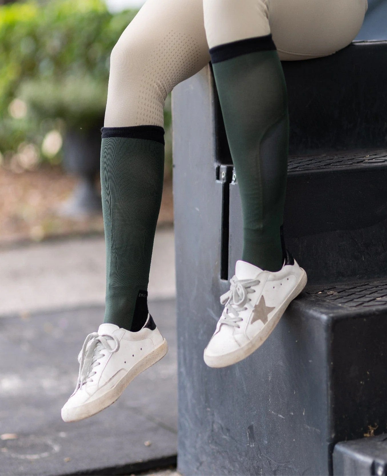 Model wearing dark green socks