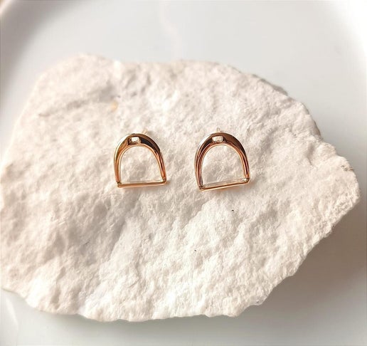 Stirrup earrings on a stone