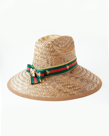 Woven hat with decorative ribbon and bee charm