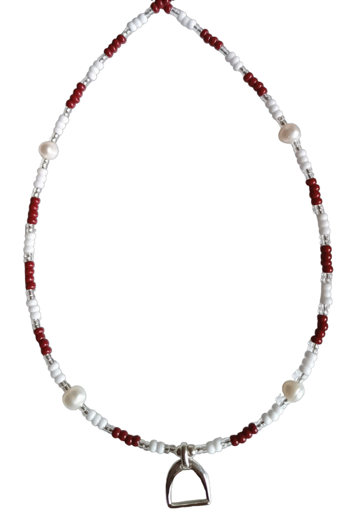 Necklace with red, clear and white beads and stirrup charm