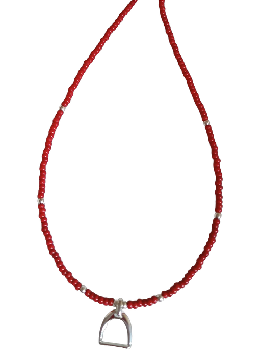 Necklace with red and silver beads and stirrup charm