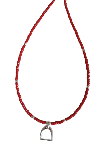 Necklace with red and silver beads and stirrup charm