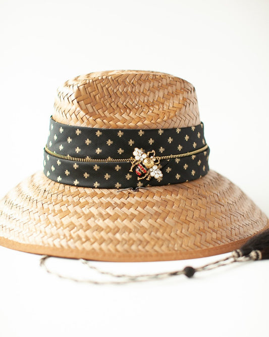 Woven hat with silk band and bee accent