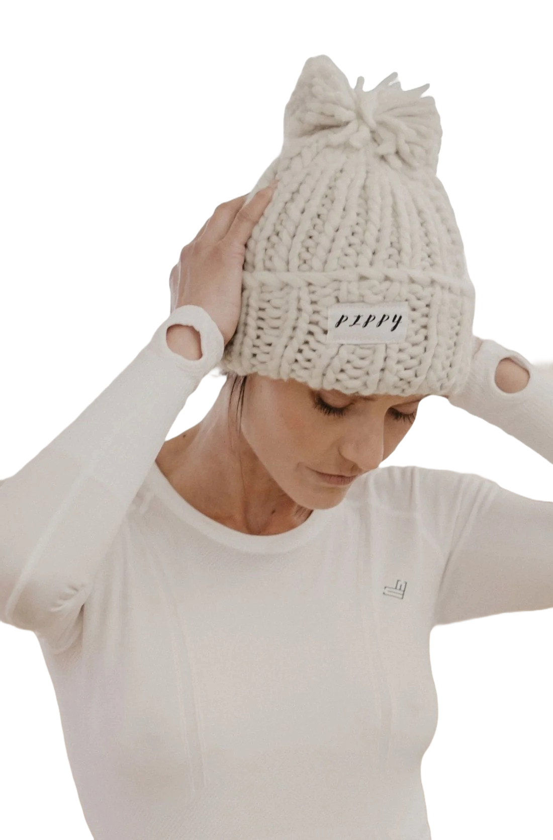 Model wearing cream beanie