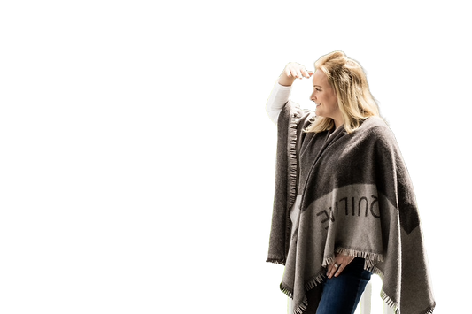 Model in wool poncho with logo