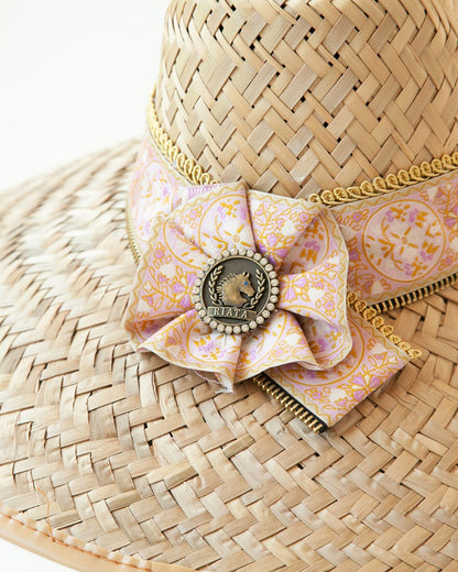 Close-up of Rose Quartz rosette with logo medallion