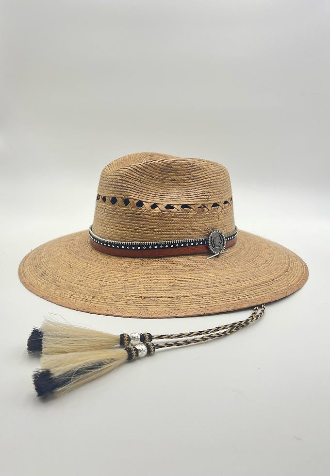 Woven hat with leather band and horsehair tassels