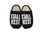 Stall Rest slippers in black, top view