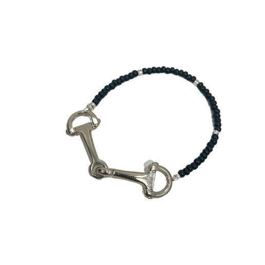 Bracelet with black beads and snaffle charm