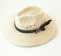 Woven hat with black leather band, feather and logo medallion