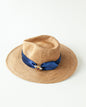 Woven hat with blue ribbon and bee charm