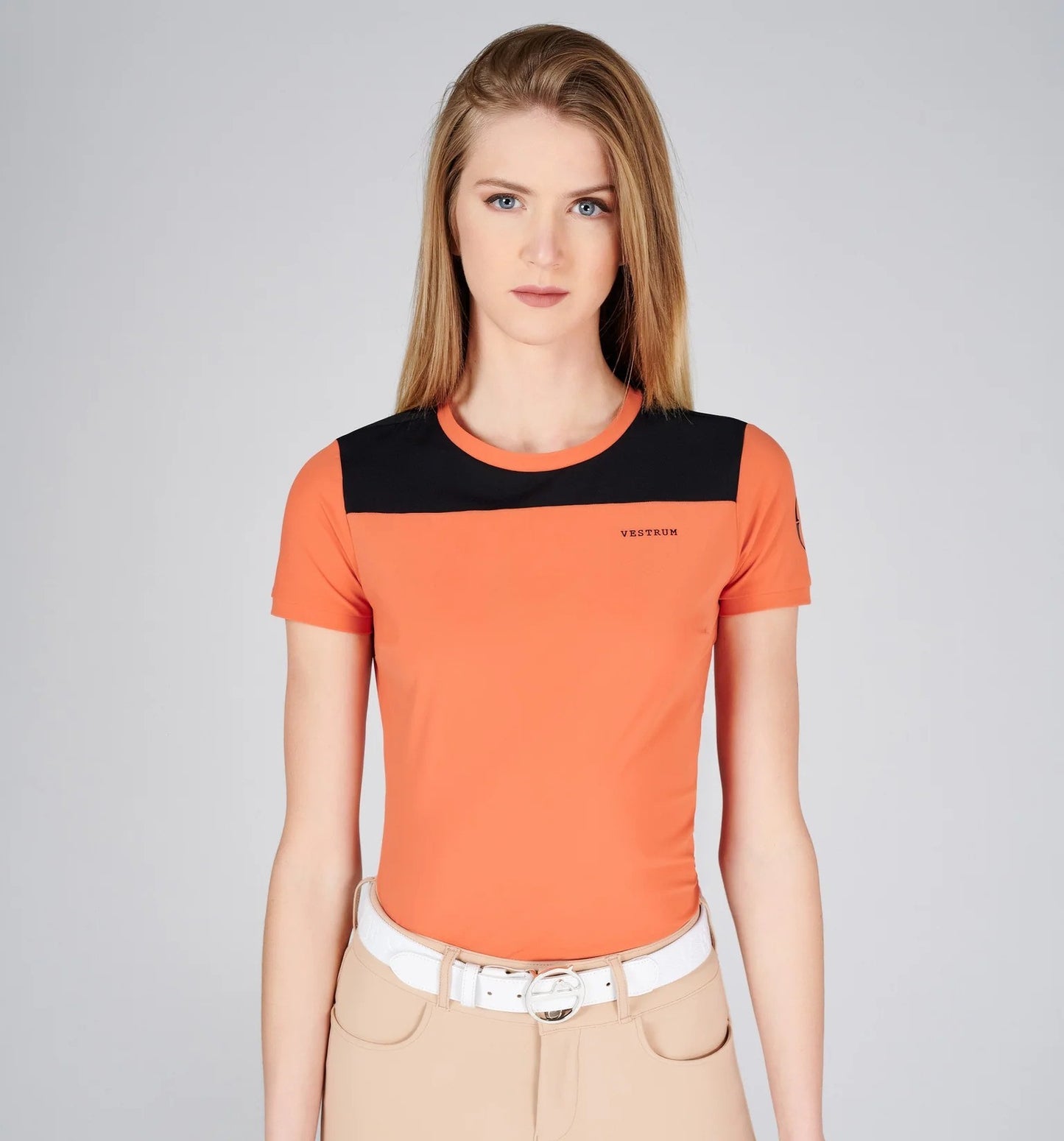 Model in orange and black training tee shirt